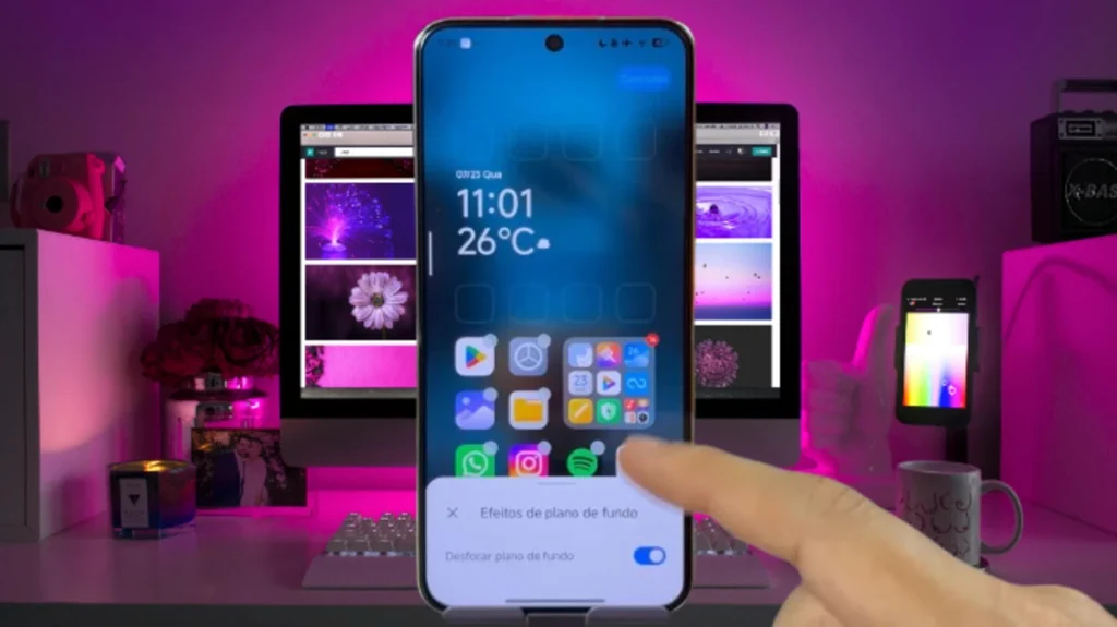 Xiaomi smartphone with the home screen displaying HyperOS Launcher 2's "Background Effects" options, overlaying app icons on a pink-lit environment.