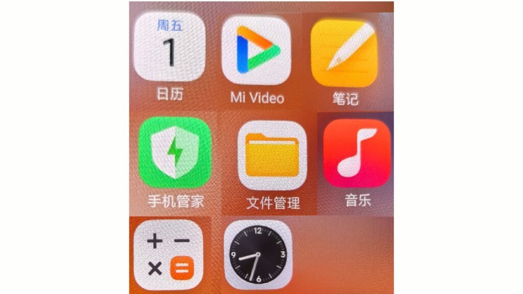 A close-up shot of a smartphone screen showing a grid of new, brightly colored icons for the upcoming HyperOS 3 operating system. The icons, with a modern, flat design, represent various system applications like Calendar, Notes, a video player, a file manager, and music. The text under the icons is in Chinese.