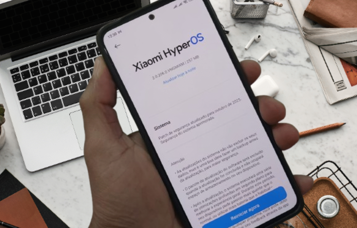 "Redmi Note 13 4G smartphone with screen displaying HyperOS 2.2 update."