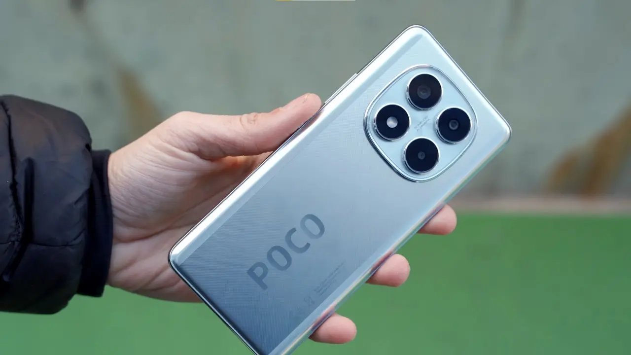 The POCO X7 smartphone in silver, featuring HyperOS 3 Global, highlights the rear camera module and the device's box in the background.