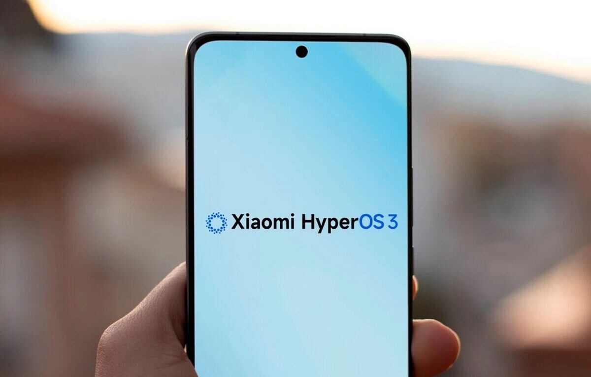 Close-up of a hand holding a modern smartphone displaying the official Xiaomi HyperOS 3 logo on a blue and white gradient screen during sunset.